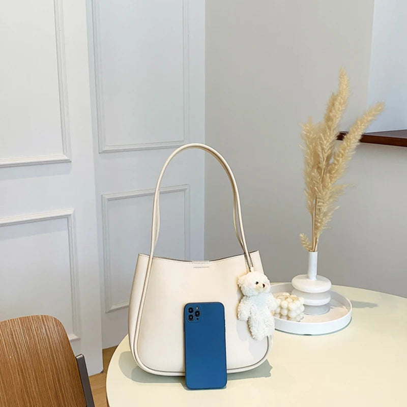 Simple And Casual New Popular PU Leather Versatile Shoulder Underarm Bag Small Fresh Solid Color Bear Pendant Handbag Your Shop Mania