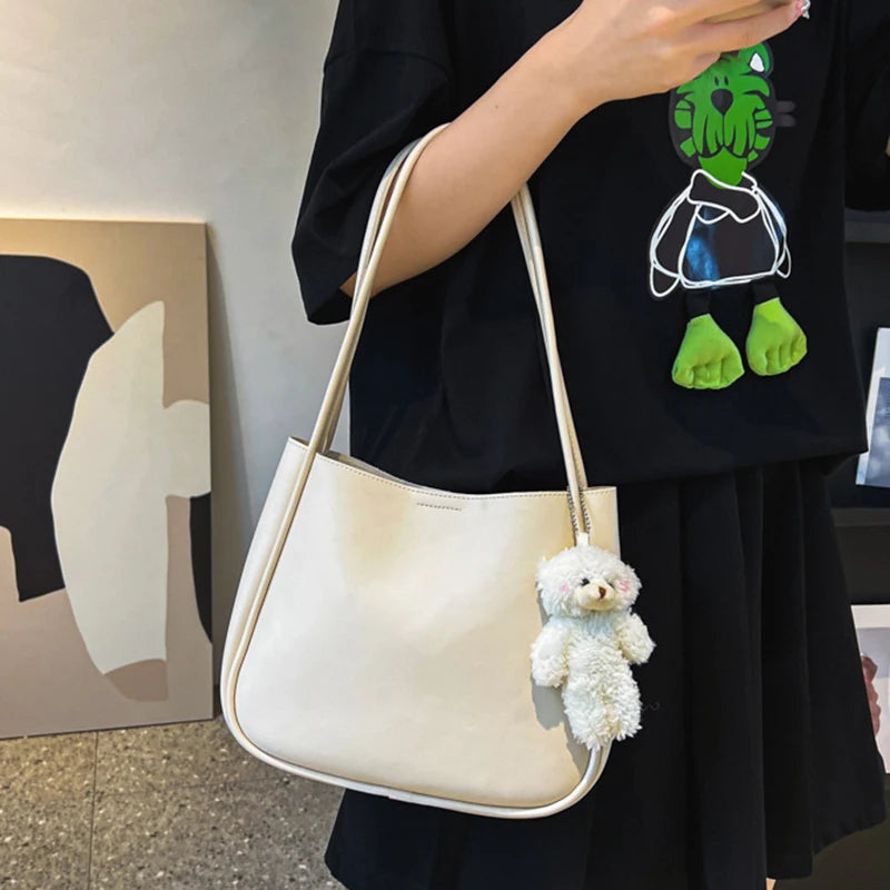 Simple And Casual New Popular PU Leather Versatile Shoulder Underarm Bag Small Fresh Solid Color Bear Pendant Handbag Your Shop Mania