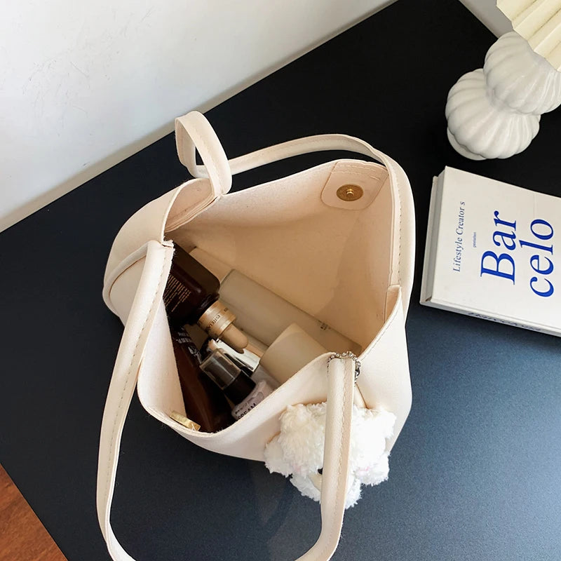 Simple And Casual New Popular PU Leather Versatile Shoulder Underarm Bag Small Fresh Solid Color Bear Pendant Handbag Your Shop Mania