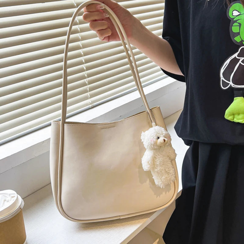 Simple And Casual New Popular PU Leather Versatile Shoulder Underarm Bag Small Fresh Solid Color Bear Pendant Handbag Your Shop Mania