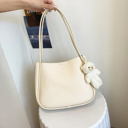 Simple And Casual New Popular PU Leather Versatile Shoulder Underarm Bag Small Fresh Solid Color Bear Pendant Handbag Your Shop Mania